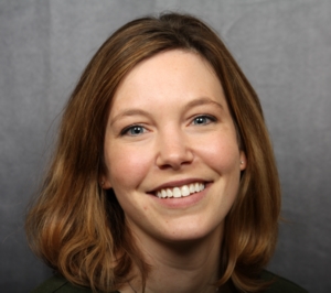 Portrait of a Happy Patient With Her Discolored Front Tooth Fixed With a Crown