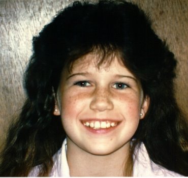 Pretty smile of this eight year old patient after her crowded teeth were straightened with retainers only