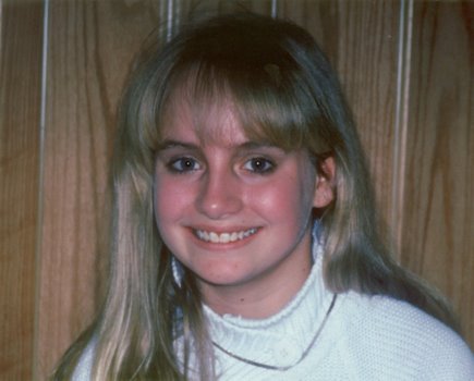 Happy patient after her crooked teeth were straightened with retainers only