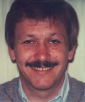 Smile before the gap in his front teeth was restored