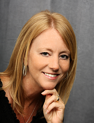 A happy patient after porcelain laminates and dental bridges have been placed